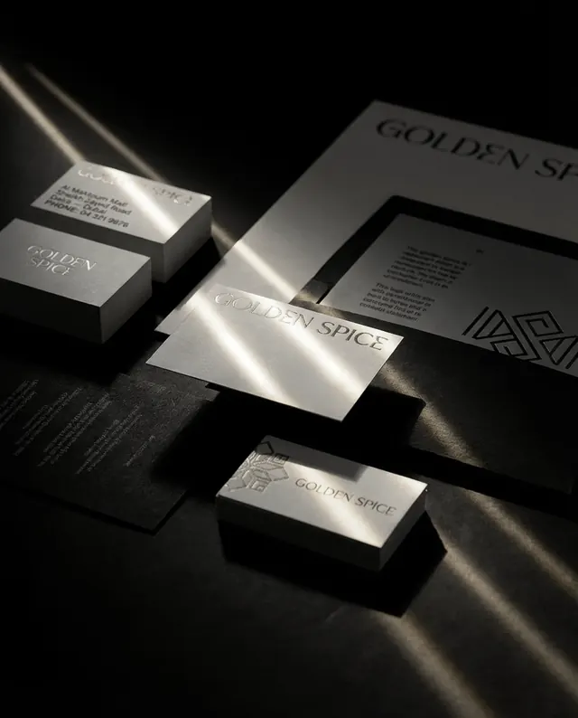 Illustrative mockup: a brand stationery set with silver foil